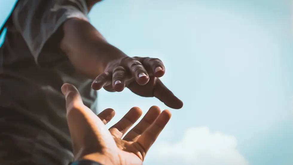 Two hands reaching towards each other against a clear blue sky, symbolizing help or connection. Sky is bright and peaceful.
