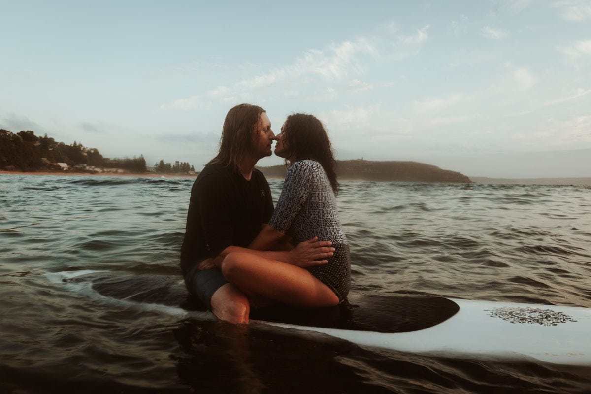Reason to Elope: To have a more adventurous and unique ceremony like these two surfers in the ocean in Australia