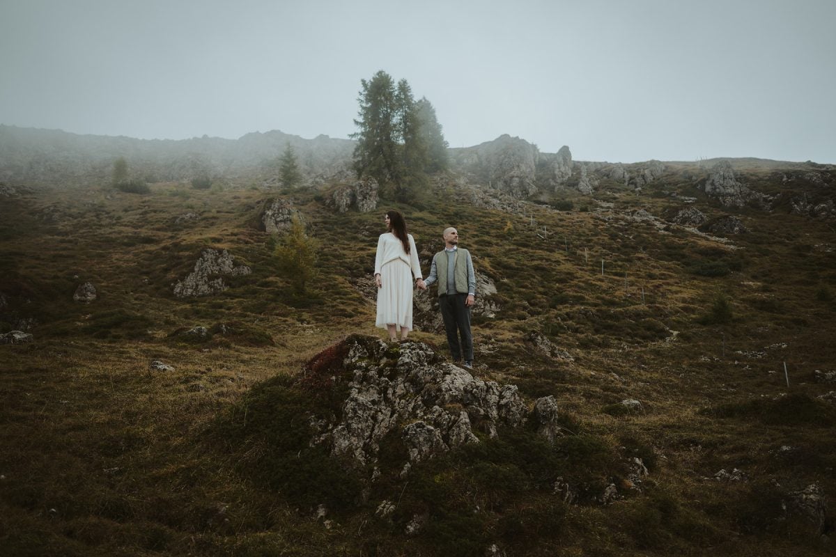 Lost in the mist, found in each other. The Dolomites don’t just set the scene—they become part of the story. Wild, intimate, and beautifully untamed—just like love should be.