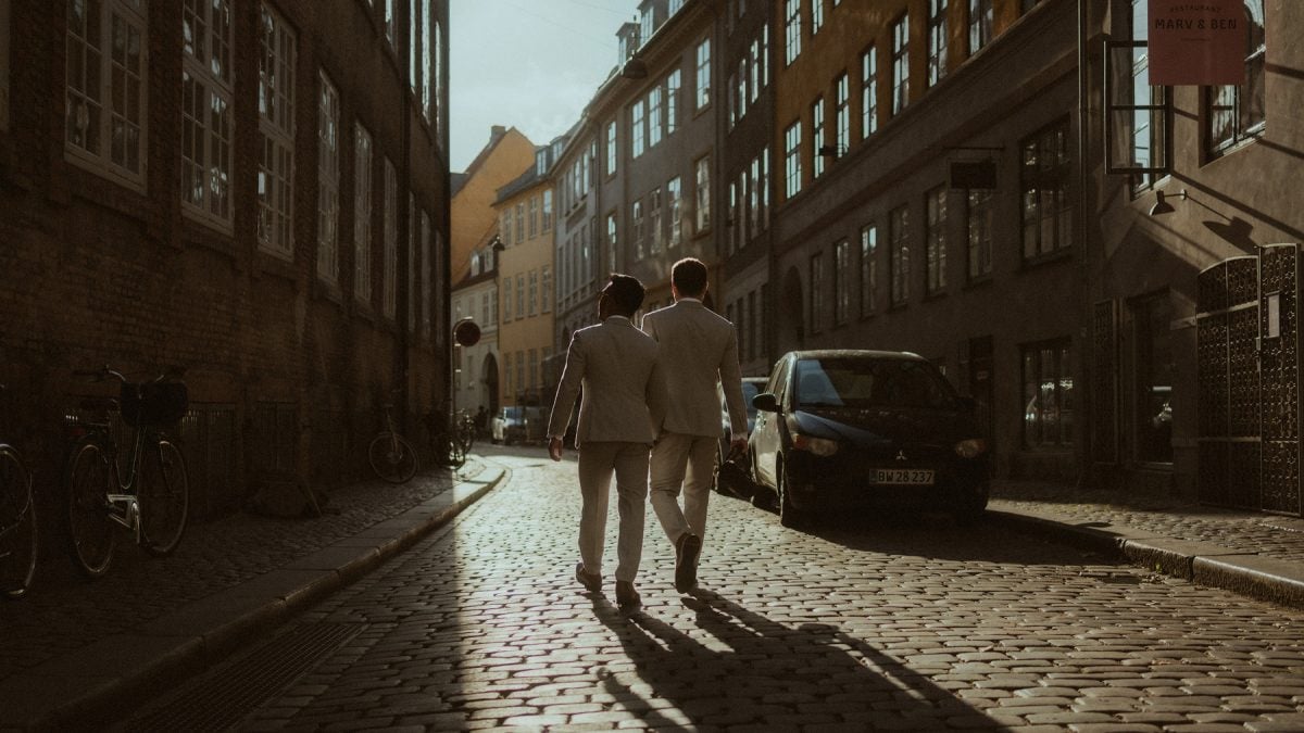 Golden hour in the streets of Copenhagen.This quiet alley lit up like a movie scene. It’s the kind of place where the city slows down—where you can just exist, hand in hand, and feel like the world was made for two.