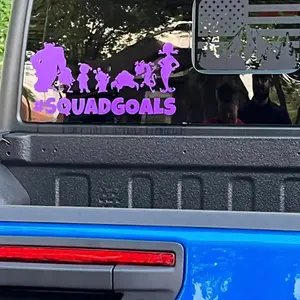Purple SquadGoals window decal on blue Jeep rear window