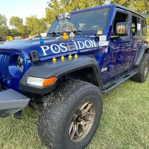 Poseidon themed custom graphics on blue Jeep Wrangler