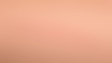 Flat scar on skin that appears a bit red on the edges and white inside. The scar is a thin line.