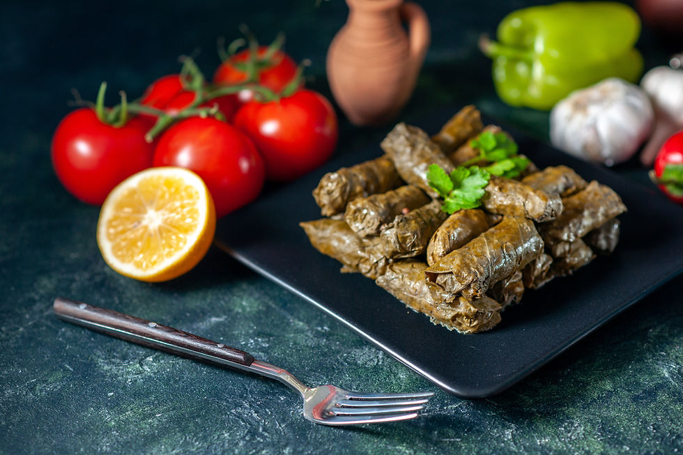 front-view-tasty-leaf-dolma-with-tomatoes-dark-background-calorie-oil-dinner-food-salad-di