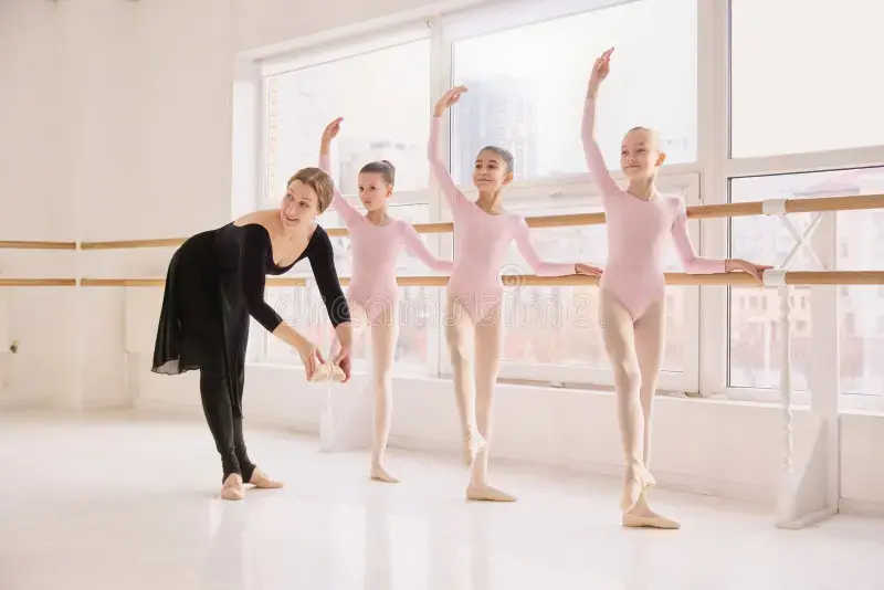 classical-ballet-lesson-children-practicing-coordinated-movements-barre-classical-ballet-l