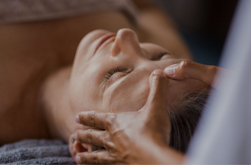 Anti-Aging Facial Near me woman receiving relaxing facial in Maui Hawaii