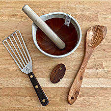 Spatula, suribachi, pointed wooden spoon and herb stripper