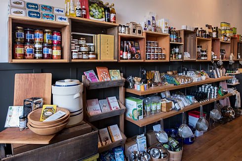 Left side of the shop with pantry items, books and kitchenwares