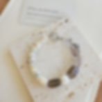 Smoky Dwelling peace bracelet with smoky quartz shell heishi and mother of pearl