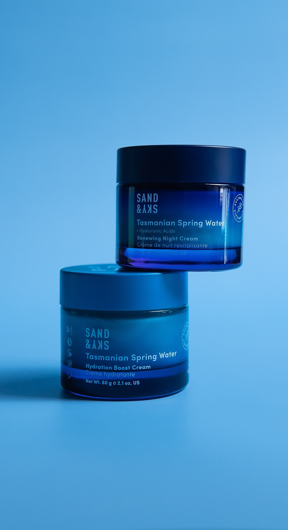 Blue Sand&Sky face creams on a blue background. Product Photography Sydney by Noisy Photos