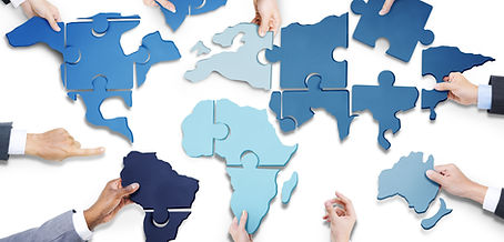 Business People with Jigsaw Puzzle Forming World Map.jpg