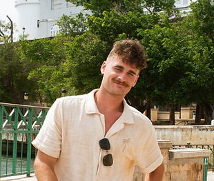 Isaiah Rohr, Young man in white shirt outside, smiling