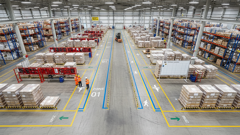 High angle view of warehouse floor with clearly marked walkways and storage zones