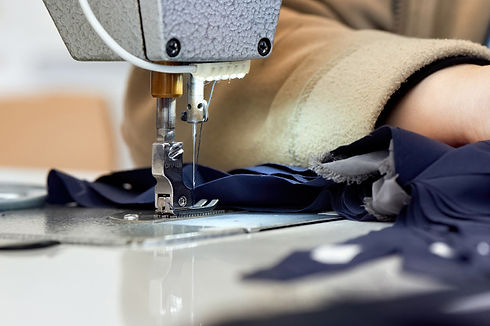 woman-working-sewing-machine-with-blue-f