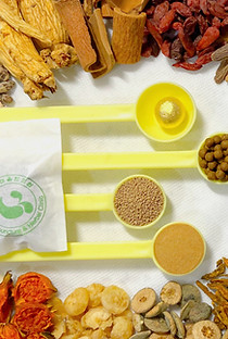 Herbal medicine pouch with Healing Soul Clinic logo, surrounded by various herbs, pills, and powders