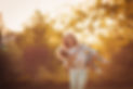 Mother and little daughter playing together in a park.jpg