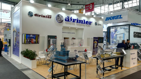 Dirinler stand, white background, blue logos, exhibited products, International Trade Fair Stand.