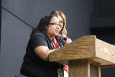 a woman at a podium speaking