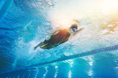person swimming in a sports pool, indoor campaign,  girl, dubai photography, dubai photo, uae, Middle east, Dubai, GCC, Advertising, campaign, ad, Key Visual, KV, positive vibe, movement, dubai photo, uae, cold tones, Lifestyle, energetic, energy, positive vibe, natural captured moments, movement, in move, swimming woman, swimming pool, water, swimming cap, swimming goggles, sport, activity, swimming suit