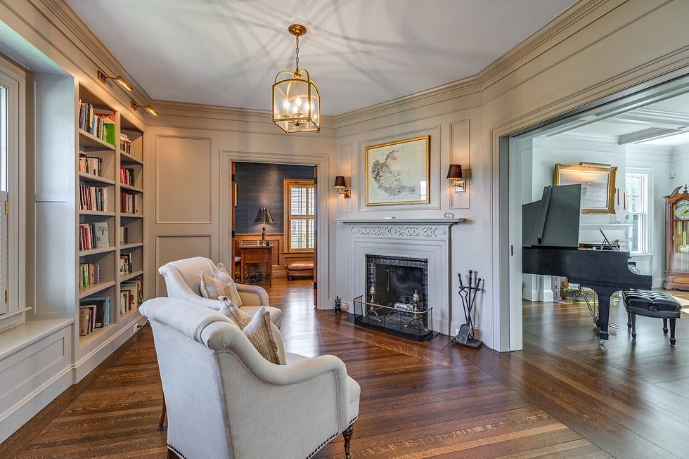 ditting room with bookshelves and fireplace