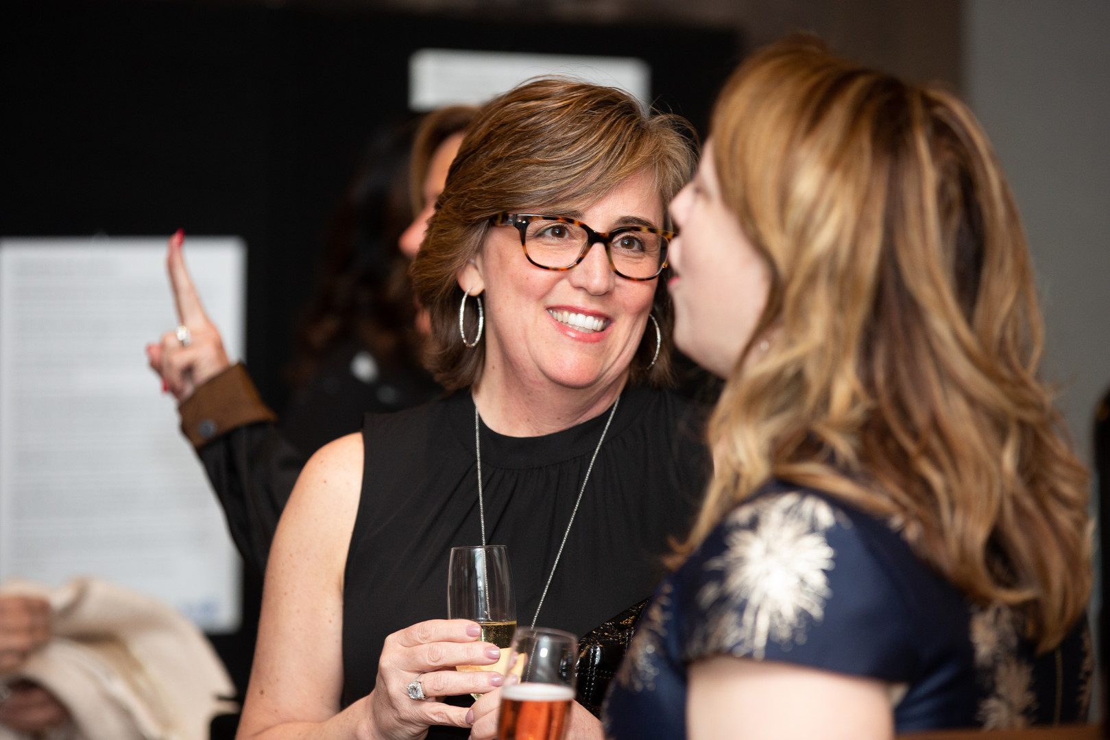 Agent, Kim Perrotti socializes at an event
