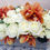 Thumbnail: White Roses and Orange Cymbidium Orchids