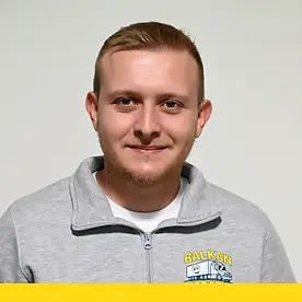Profile photo of a male team member wearing a gray Balkan Dispatch hoodie