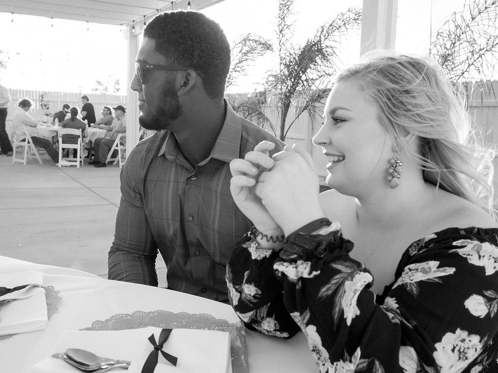 Couple seated at the table before the wedding