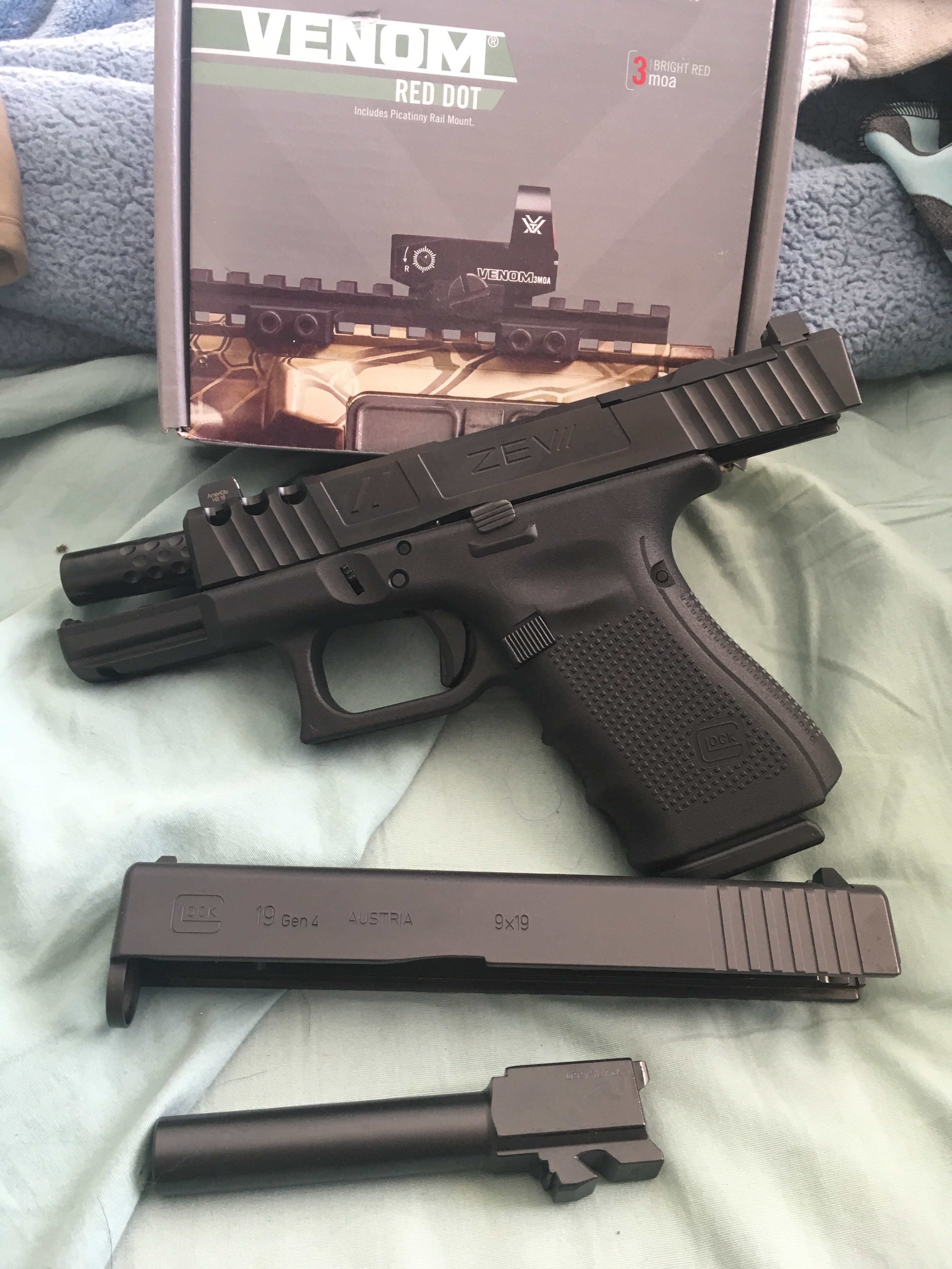 Glock 19 gen 4 with additional zev tech slide content media