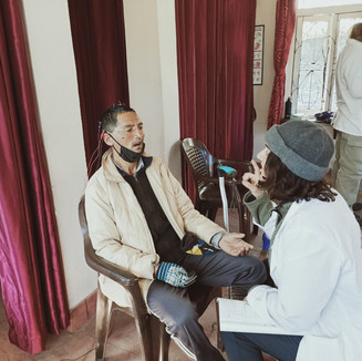 Nepalese man works with female practitioner
