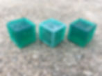 3 d6 in different stages - cured with supports freshly cut, sanded, and after gloss paint.