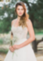 Understated ball gown with beaded top and simple tulle skirt.