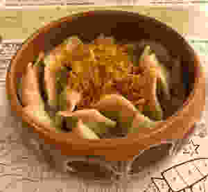 Bowl of various dumplings with onions on top, Moscow Russia