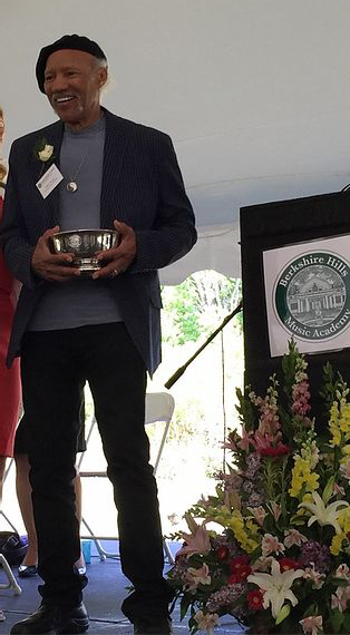 Image of Charles Neville accepting BHMA's Visionary Award.