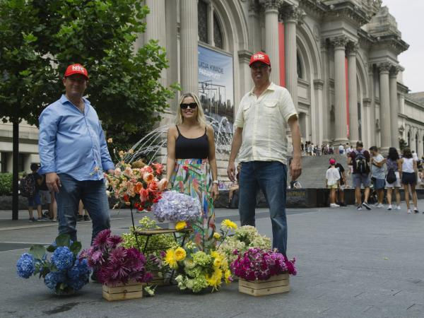 José R. Azout, Catalina Arango Gómez and Daniel Vélez in front of the Metropolitan Museum of Art in New York
