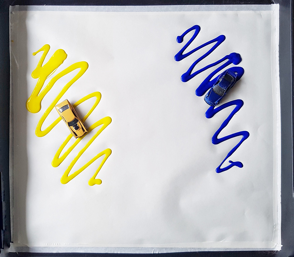 Colour mixing blue and yellow with toy cars