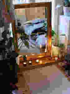 meditation corner with mirror and candles for yoga