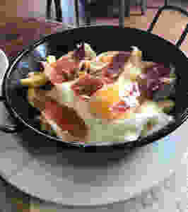 Fries, eggs and ham tapas dish in cadiz spain