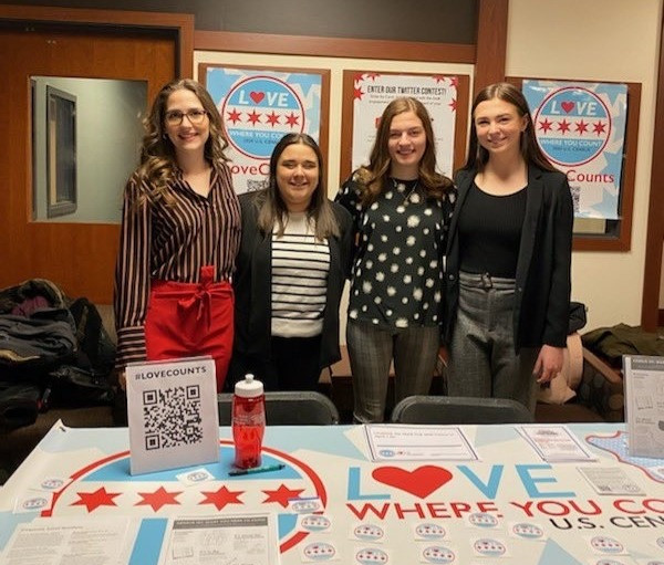 Stephanie Robertson, Lauren Russett, Natalie Rohman, Maddie Torti, and Callie Boboc (not pictured) at the DePaul PRSSA District Conference promoting Love Where You Count