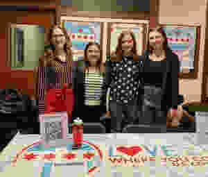 Stephanie Robertson, Lauren Russett, Natalie Rohman, Maddie Torti, and Callie Boboc (not pictured) at the DePaul PRSSA District Conference promoting Love Where You Count