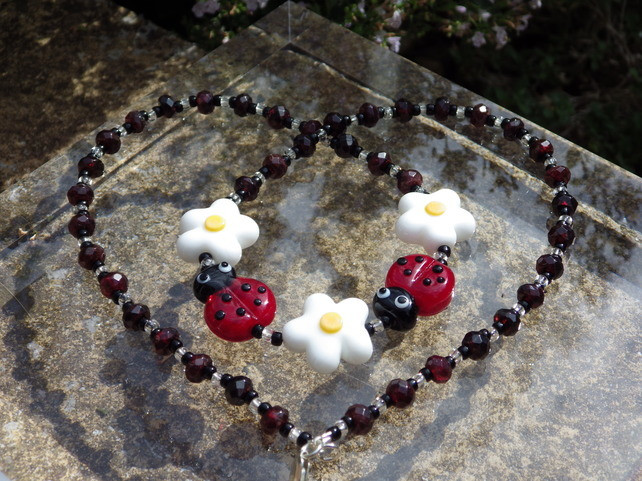 Necklace using lampwork glass beads teamed with garnet rondelle beads
