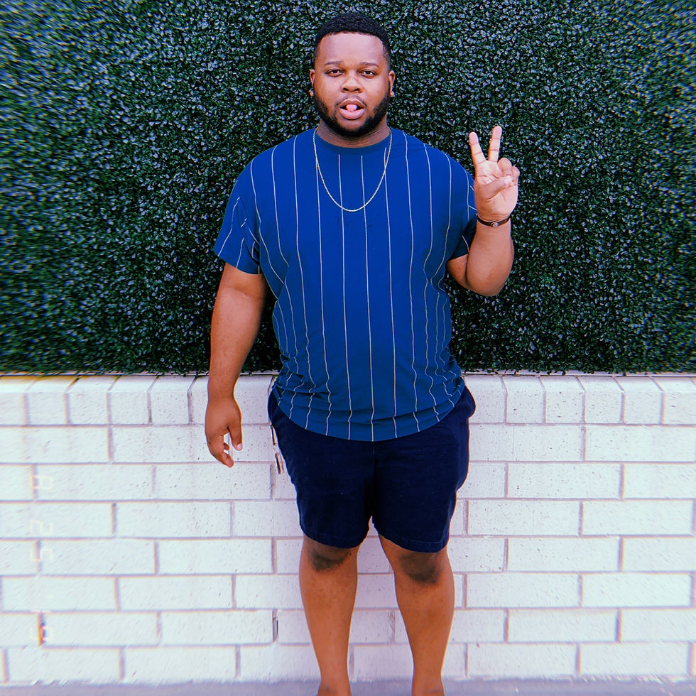 man standing giving the peace sign