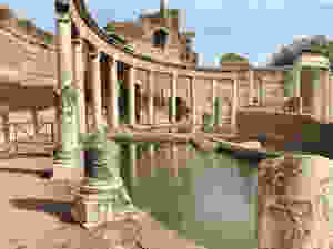 columns stretching around the theater's moat