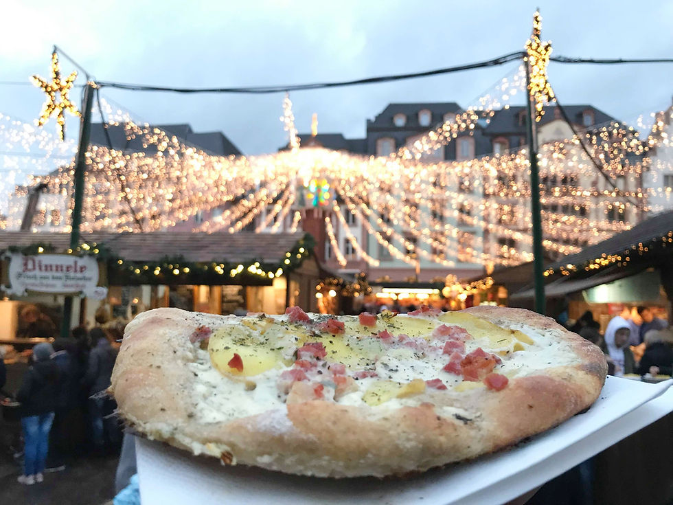 Dinnete pizza dish at Mainz Christmas market in Germany