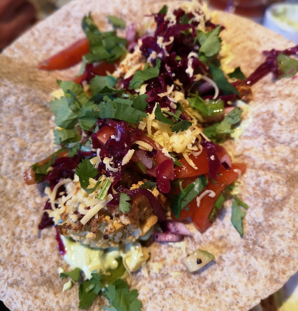 Crispy cauliflower tacos with reclaimed red kraut, tomato salsa, avocado and fresh coriander