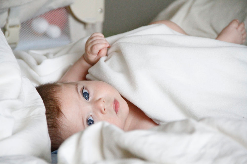 How Can I Stop My Baby From Standing Up In Their Cot?