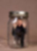 Man in mason jar feeling stuck, trapped, with no way out.
