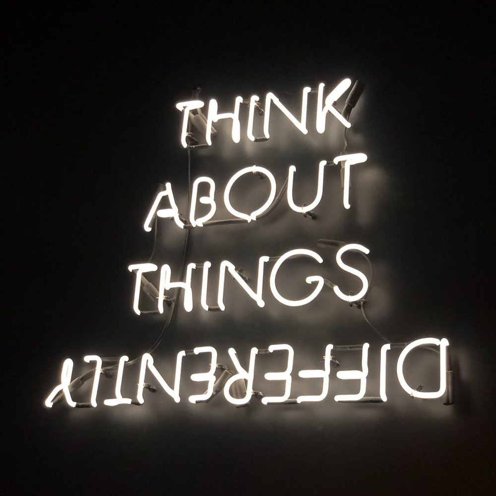 Think about things differently sign