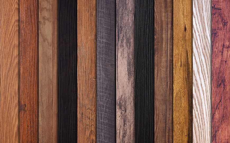 Boards of wood in various colors arranged vertically in a neat row.