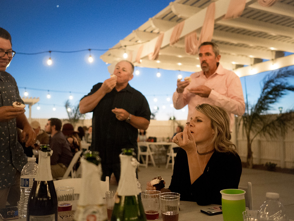 Guests eating at dusk in the outdoor venue